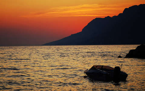 csónak naplemente tenger